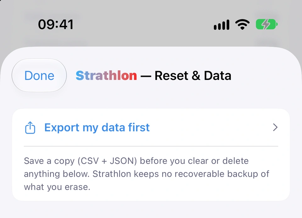 The top of the Reset & Data screen: the Export my data first card, which says to save a copy (CSV + JSON) before you clear or delete anything below, because Strathlon keeps no recoverable backup of what you erase.