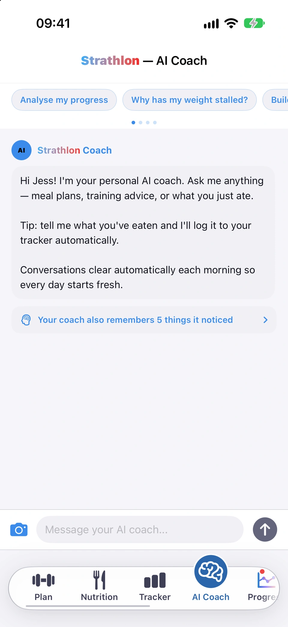The AI Coach tab at the start of the day: under the title, a row of quick-question chips reading Analyse my progress and Why has my weight stalled?, with a third running off the edge and four page dots beneath, then the coach's greeting and the message box at the bottom.