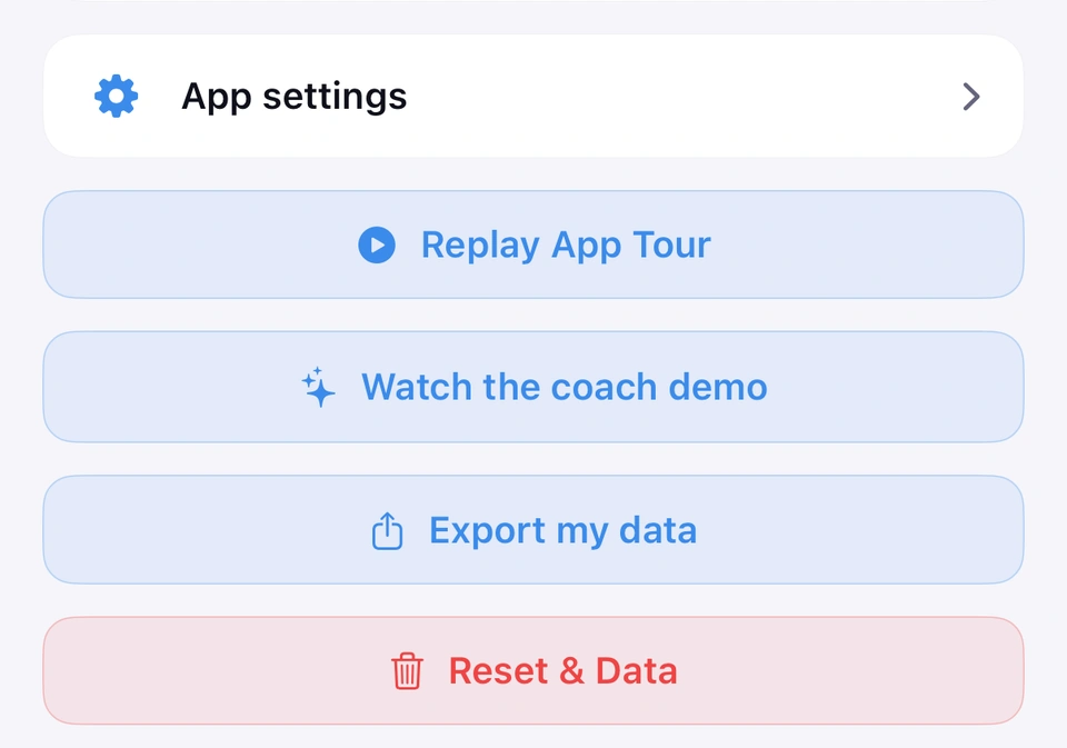The lower part of the Settings tab: App settings, then the Replay App Tour button, Watch the coach demo, Export my data and Reset & Data.