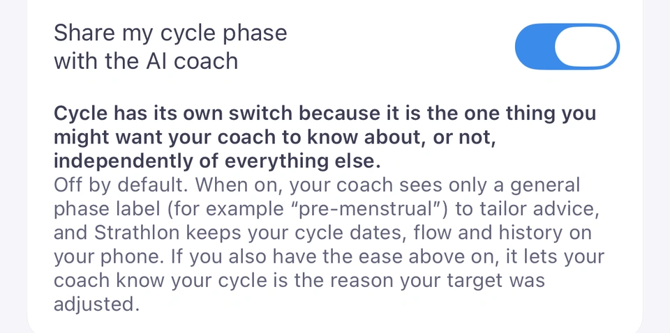 The Share my cycle phase with the AI coach switch under Cycle-aware insights, switched on, with its note: off by default; when on, your coach sees only a general phase label, such as pre-menstrual, and Strathlon keeps your cycle dates, flow and history on your phone.